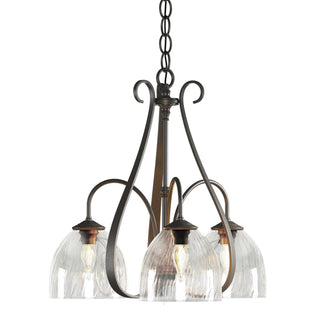 Buy dark-smoke-with-water-glass-ll-glass-and-clear-textured-shade Sweeping Taper Chandelier by Hubbardton Forge