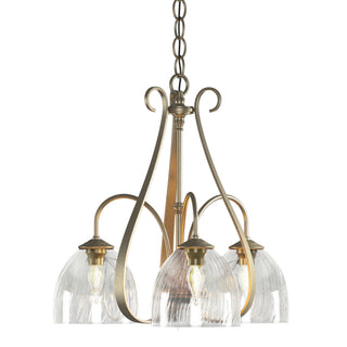 Buy soft-gold-with-water-glass-ll-glass-and-clear-textured-shade Sweeping Taper Chandelier by Hubbardton Forge