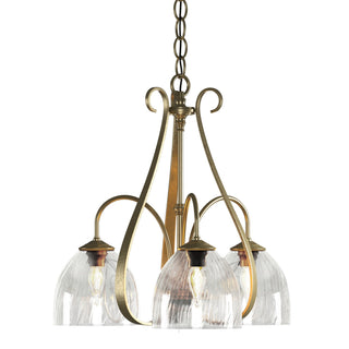 Buy modern-brass-with-water-glass-ll-glass-and-clear-textured-shade Sweeping Taper Chandelier by Hubbardton Forge