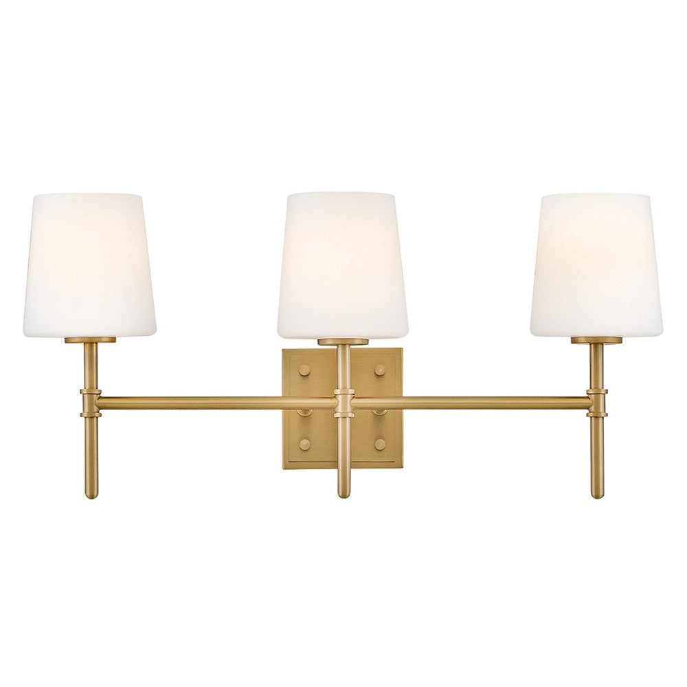 Saunders Vanity by Hinkley – Lights: 3 Light (6.25"L x 23.00"W x 10.75"H) – Finish: Lacquered Brass with Etched Opal Glass and White Shade – Hinkley-56953LCB