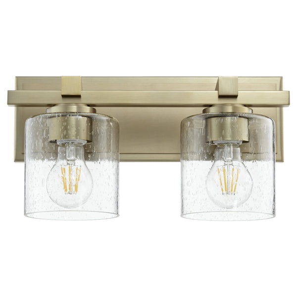Quorum - 5669-2-280 - Two Light Wall Mount - 5669 Cylinder Lighting Series - Aged Brass w/ Clear/Seeded from Lighting & Bulbs Unlimited in Charlotte, NC