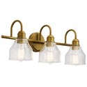 Kichler - 45973NBR - Three Light Bath - Avery - Natural Brass from Lighting & Bulbs Unlimited in Charlotte, NC