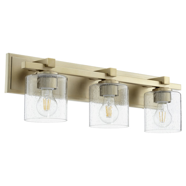 Quorum - 5369-3-280 - Three Light Vanity - 5369 Vanities - Aged Brass w/ Clear/Seeded from Lighting & Bulbs Unlimited in Charlotte, NC