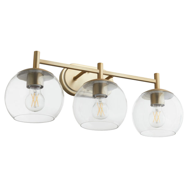 Quorum - 578-3-80 - Three Light Vanity - Lyon - Aged Brass from Lighting & Bulbs Unlimited in Charlotte, NC