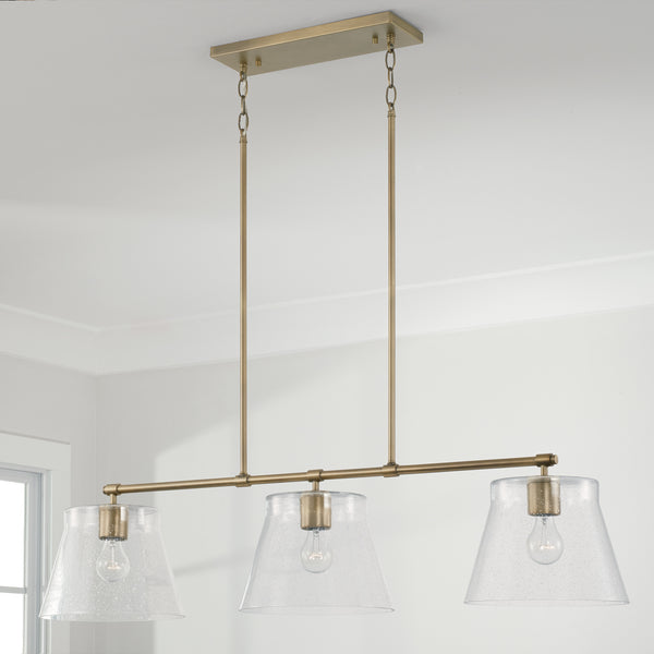 Three Light Island Pendant from the Baker Collection in Aged Brass Finish by Capital Lighting