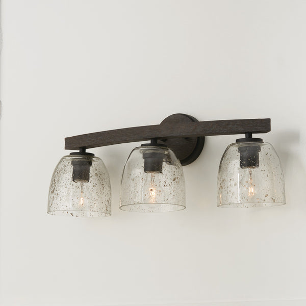 Three Light Vanity from the Clive Collection in Carbon Grey and Black Iron Finish by Capital Lighting