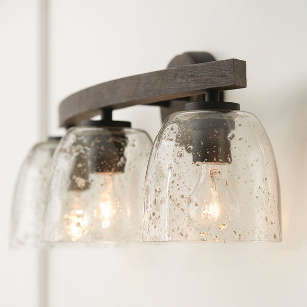 Three Light Vanity from the Clive Collection in Carbon Grey and Black Iron Finish by Capital Lighting